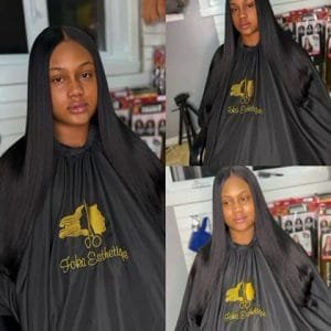 Femme avec de longues Boho Braids noires et volumineuses, tresses avec mèches bouclées libres, coiffure protectrice.