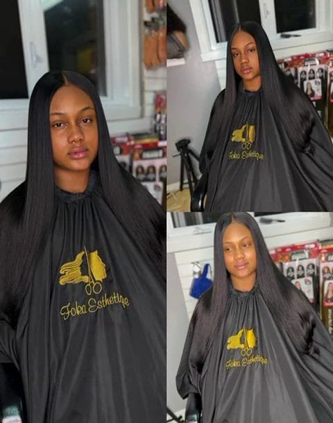 Femme avec de longues Boho Braids noires et volumineuses, tresses avec mèches bouclées libres, coiffure protectrice.